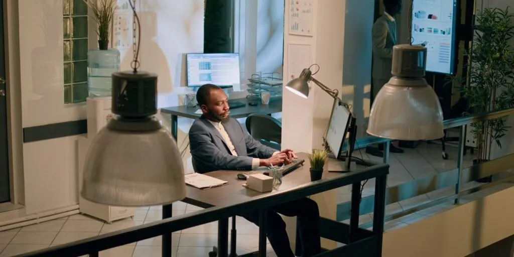 Man using a computer in a Nairobi office to organize bookkeeping tasks – Zidika Consulting, Kenya