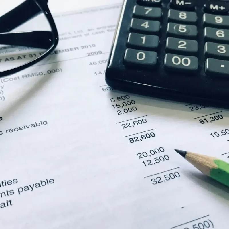 Accounting setup with report, calculator, and glasses – Nairobi – Zidika Consulting