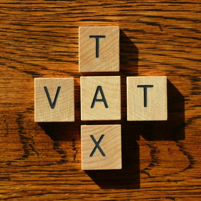Wooden cubes spelling TAX and VAT for Kenyan businesses – Zidika Consulting