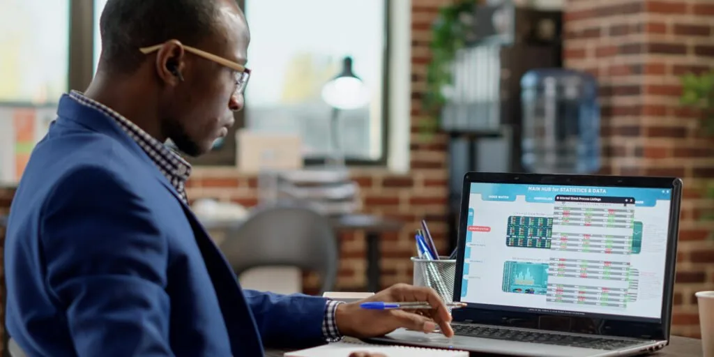 Accountant automating finances with a laptop at a Nairobi office